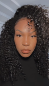 woman wearing e-curly bundles wearing a black top with a white background