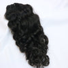a bundle of black natural curly hair extensions on a white background