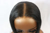 closeup of undetectable thin hd lace closure placed on a mannequin head against a white background