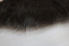 close-up of thin hd lace frontal laid against a white surface