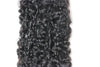 a hair bundle in the e-curly texture laid against a white surface