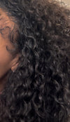 cropped picture of a woman wearing e-curly bundles