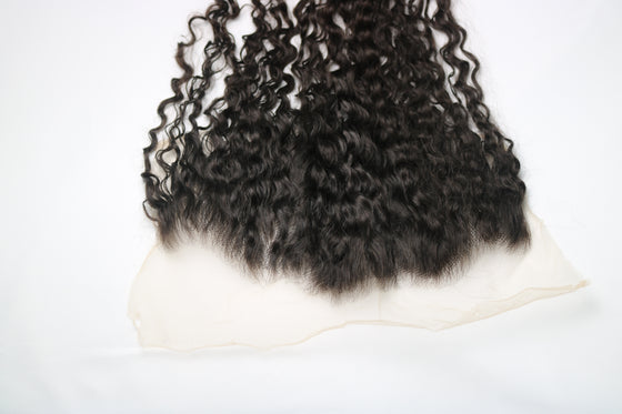 undetectable thin hd lace frontal in the e-curly texture laid against a white surface